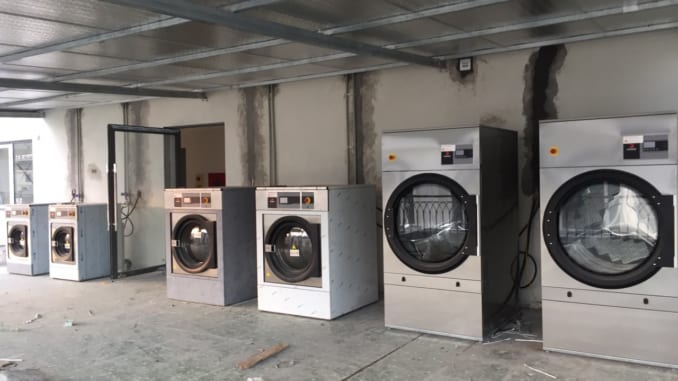 Vì sao nên mua máy giặt công nghiệp mới